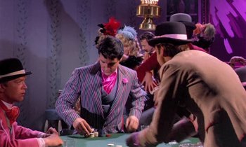 Movie still from “Frankie and Johnny” (1966), directed by Frederick De Cordova – A group of people playing a game of poker; Medium shot, Over the shoulder angle