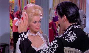 Movie still from “Frankie and Johnny” (1966), directed by Frederick De Cordova – A man and a woman are dancing in a ballroom; Medium shot, Over the shoulder angle
