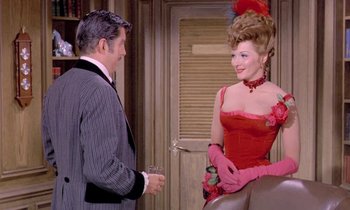Movie still from “Frankie and Johnny” (1966), directed by Frederick De Cordova – A man and a woman dressed up in formal wear; Medium shot, Over the shoulder angle