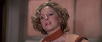 Movie still from “Funny Lady” (1975), directed by Herbert Ross – A person with curly hair; Close Up shot, Low angle