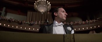 Movie still from “Funny Lady” (1975), directed by Herbert Ross – A man in a tuxedo is looking up at the ceiling; Close Up shot, Low angle