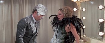 Movie still from “Funny Lady” (1975), directed by Herbert Ross – A man and a woman dressed in costumes; Medium shot, Low angle