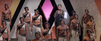 Movie still from “Funny Lady” (1975), directed by Herbert Ross – A group of men and women standing next to each other; Wide shot, Low angle