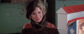 Movie still from “Funny Lady” (1975), directed by Herbert Ross – A person wearing a hat; Close Up shot, High angle