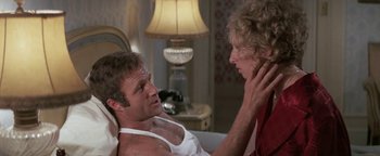 Movie still from “Funny Lady” (1975), directed by Herbert Ross – A man and a woman are talking in a room; Close Up shot, Over the shoulder angle