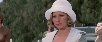 Movie still from “Funny Lady” (1975), directed by Herbert Ross – A person wearing a white hat; Close Up shot, Low angle
