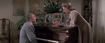 Movie still from “Funny Lady” (1975), directed by Herbert Ross – An older man and woman sitting at a piano; Medium shot, High angle