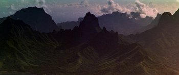 Movie still from “Hawaii” (1966), directed by George Roy Hill – A view of a mountain range from the top of a hill; Extreme Wide shot, High angle