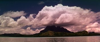 Movie still from “Hawaii” (1966), directed by George Roy Hill – A large cloud formation over a body of water; Extreme Wide shot, Low angle