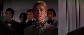 Movie still from “Hawaii” (1966), directed by George Roy Hill – A person wearing a suit and tie; Close Up shot, Low angle