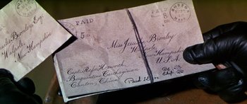 Movie still from “Hawaii” (1966), directed by George Roy Hill – An old envelope is shown on top of a table; Extreme Close Up shot, Overhead angle