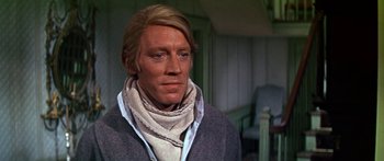 Movie still from “Hawaii” (1966), directed by George Roy Hill – A person wearing a sweater and a scarf; Close Up shot, Over the shoulder angle