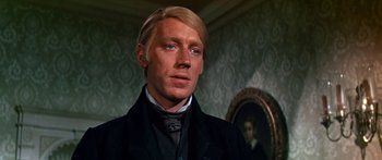 Movie still from “Hawaii” (1966), directed by George Roy Hill – A person wearing a suit and tie; Close Up shot, Low angle