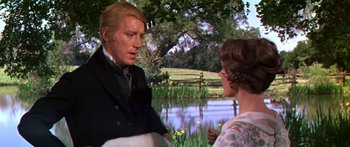 Movie still from “Hawaii” (1966), directed by George Roy Hill – A man and a woman talking in front of a pond; Medium shot, Over the shoulder angle