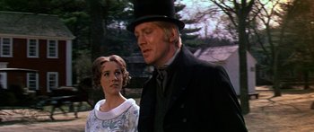 Movie still from “Hawaii” (1966), directed by George Roy Hill – A man and a woman standing next to each other in front of trees; Medium shot, Over the shoulder angle