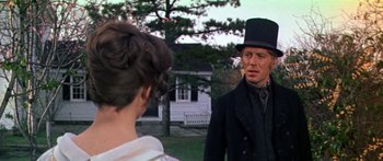 Movie still from “Hawaii” (1966), directed by George Roy Hill – A man and a woman standing in front of a white house; Close Up shot, Over the shoulder angle