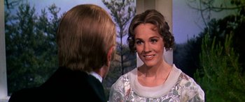 Movie still from “Hawaii” (1966), directed by George Roy Hill – A man and a woman are talking to each other; Close Up shot, Over the shoulder angle