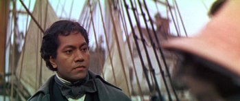 Movie still from “Hawaii” (1966), directed by George Roy Hill – A person wearing a coat and tie; Close Up shot, Over the shoulder angle