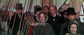 Movie still from “Hawaii” (1966), directed by George Roy Hill – A group of people standing on top of a boat; Medium shot, Low angle