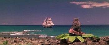 Movie still from “Hawaii” (1966), directed by George Roy Hill – A sailboat in the water near the shore; Extreme Wide shot, Low angle