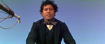 Movie still from “Hawaii” (1966), directed by George Roy Hill – A man wearing a bow tie and a suit; Close Up shot, Low angle