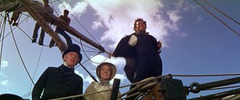 Movie still from “Hawaii” (1966), directed by George Roy Hill – A group of people standing on top of a boat; Medium shot, Low angle