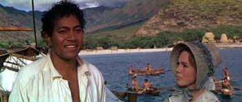 Movie still from “Hawaii” (1966), directed by George Roy Hill – A group of people on small boats in the water; Medium shot, Over the shoulder angle