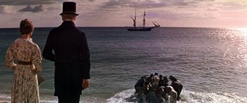 Movie still from “Hawaii” (1966), directed by George Roy Hill – A group of people in the water near a boat; Extreme Wide shot, High angle