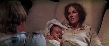 Movie still from “Hawaii” (1966), directed by George Roy Hill – A woman and a baby laying in a bed; Close Up shot, High angle