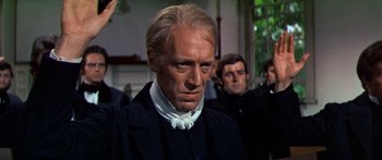 Movie still from “Hawaii” (1966), directed by George Roy Hill – A person wearing a suit and tie; Close Up shot, Over the shoulder angle