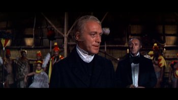 Movie still from “Hawaii” (1966), directed by George Roy Hill – A person wearing a suit and tie; Medium shot, Low angle