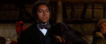 Movie still from “Hawaii” (1966), directed by George Roy Hill – A man and a woman are standing next to each other; Close Up shot, Over the shoulder angle