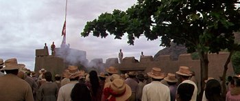 Movie still from “Hawaii” (1966), directed by George Roy Hill – A crowd of people standing around a building; Extreme Wide shot, Low angle