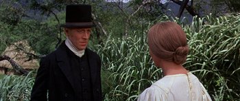 Movie still from “Hawaii” (1966), directed by George Roy Hill – A man and a woman talking in front of a forest; Medium shot, Over the shoulder angle