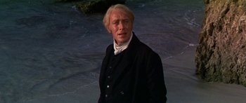 Movie still from “Hawaii” (1966), directed by George Roy Hill – A person wearing a suit and tie; Close Up shot, Low angle