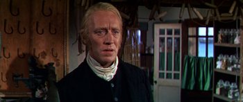 Movie still from “Hawaii” (1966), directed by George Roy Hill – A man with blonde hair and a white shirt; Close Up shot, Over the shoulder angle