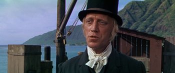 Movie still from “Hawaii” (1966), directed by George Roy Hill – A person wearing a top hat; Close Up shot, Low angle