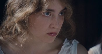 Movie still from “House of Tolerance” (2011), directed by Bertrand Bonello – A person with blue eyes; Close Up shot, Over the shoulder angle