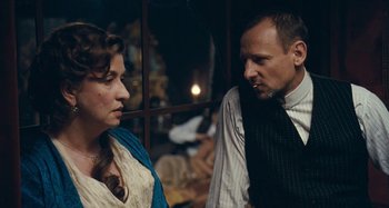 Movie still from “House of Tolerance” (2011), directed by Bertrand Bonello – A man and a woman talking to each other; Close Up shot, Over the shoulder angle