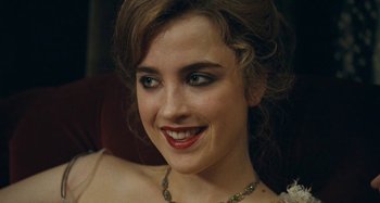 Movie still from “House of Tolerance” (2011), directed by Bertrand Bonello – A person wearing a necklace; Close Up shot, High angle