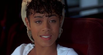 Movie still from “Jason's Lyric” (1994), directed by Doug McHenry – A person wearing a white shirt; Close Up shot, High angle