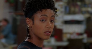 Movie still from “Jason's Lyric” (1994), directed by Doug McHenry – A person wearing a black shirt; Close Up shot, Over the shoulder angle