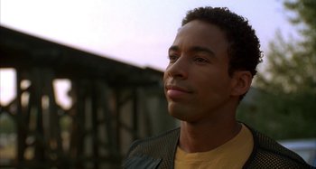 Movie still from “Jason's Lyric” (1994), directed by Doug McHenry – A person looking up at the sky; Close Up shot, Over the shoulder angle