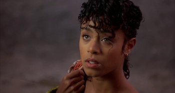 Movie still from “Jason's Lyric” (1994), directed by Doug McHenry – A person holding a cell phone; Close Up shot, High angle