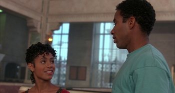 Movie still from “Jason's Lyric” (1994), directed by Doug McHenry – A man and a woman talking to each other; Close Up shot, Over the shoulder angle