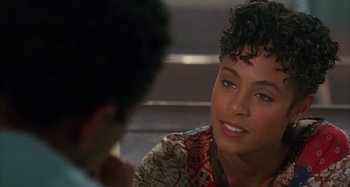 Movie still from “Jason's Lyric” (1994), directed by Doug McHenry – A woman sitting down talking to a man; Close Up shot, Over the shoulder angle