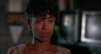 Movie still from “Jason's Lyric” (1994), directed by Doug McHenry – A person wearing a floral shirt; Close Up shot, Over the shoulder angle