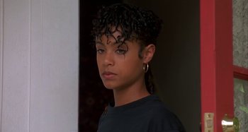 Movie still from “Jason's Lyric” (1994), directed by Doug McHenry – A person wearing a black shirt; Close Up shot, High angle