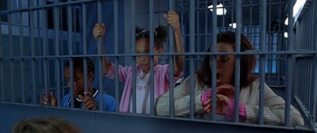 Movie still from “Johnson Family Vacation” (2004), directed by Christopher Erskin – A group of people in a jail cell; Medium shot, High angle