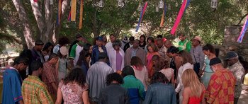 Movie still from “Johnson Family Vacation” (2004), directed by Christopher Erskin – A group of people standing around a tree; Wide shot, High angle